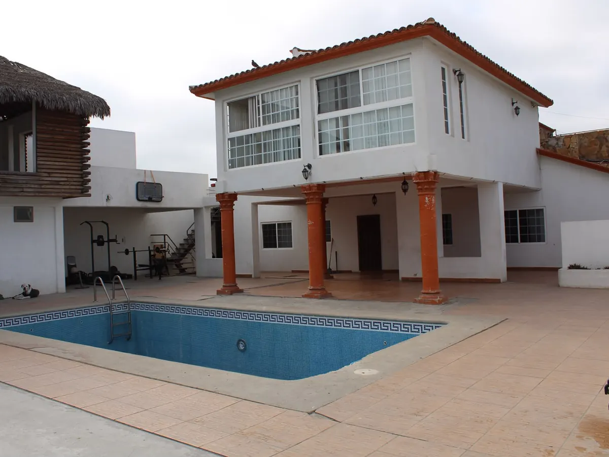 The Despertares facility: a two-storey building with a covered terrace, swimming pool and gym area.